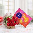 12 red roses bouquet with Cadburys celebration box